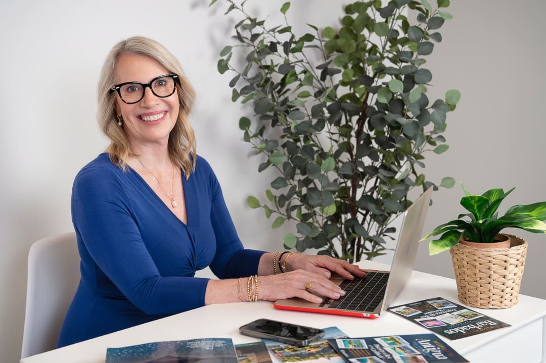Carol Jurriaans-Whiley at her travel-planning desk